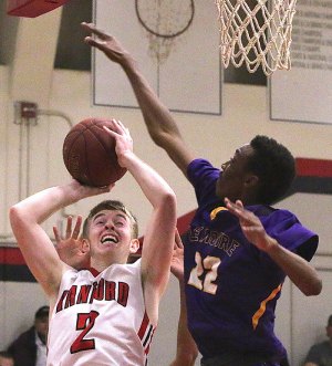 Lemoore's Jayden Jones plays tough defense on Hanford's Karsten Gregory.